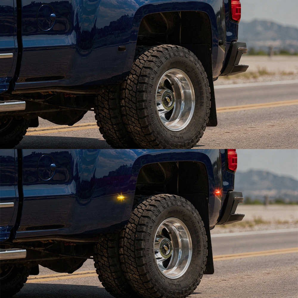 Close-up of a truck's tire on a road with mountains in the background