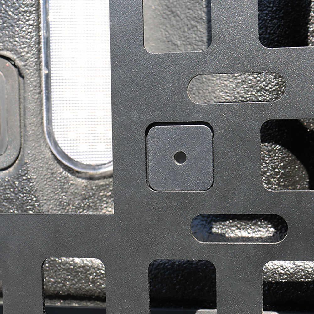 Close-up of a textured metal surface with a square hole