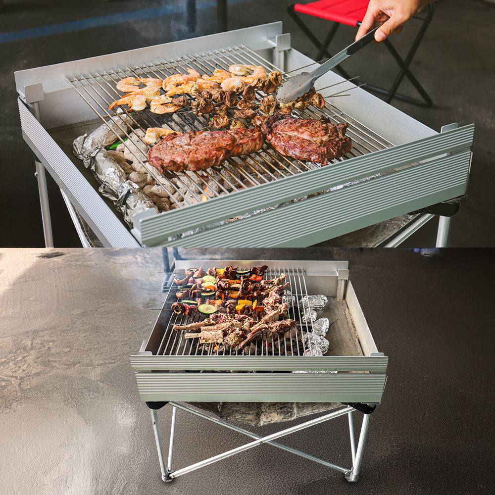aluminum portable barbecue grill in use with steak, shrimp and lamb.