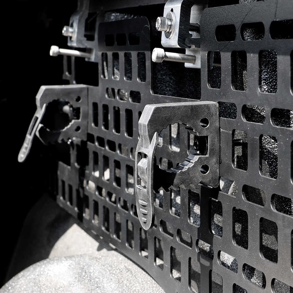 Close-up of a metal grille with bolts on a dark background