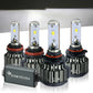 Four SYNETICUSA car light bulbs on a reflective surface with a neutral background