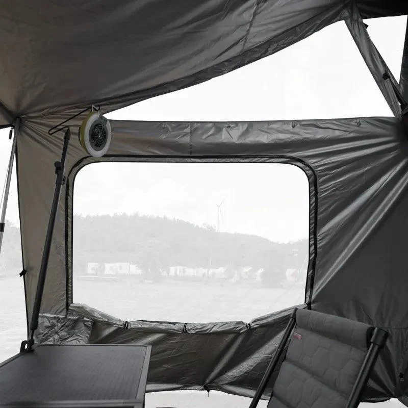 Camping tent interior with a view of mountains through the window
