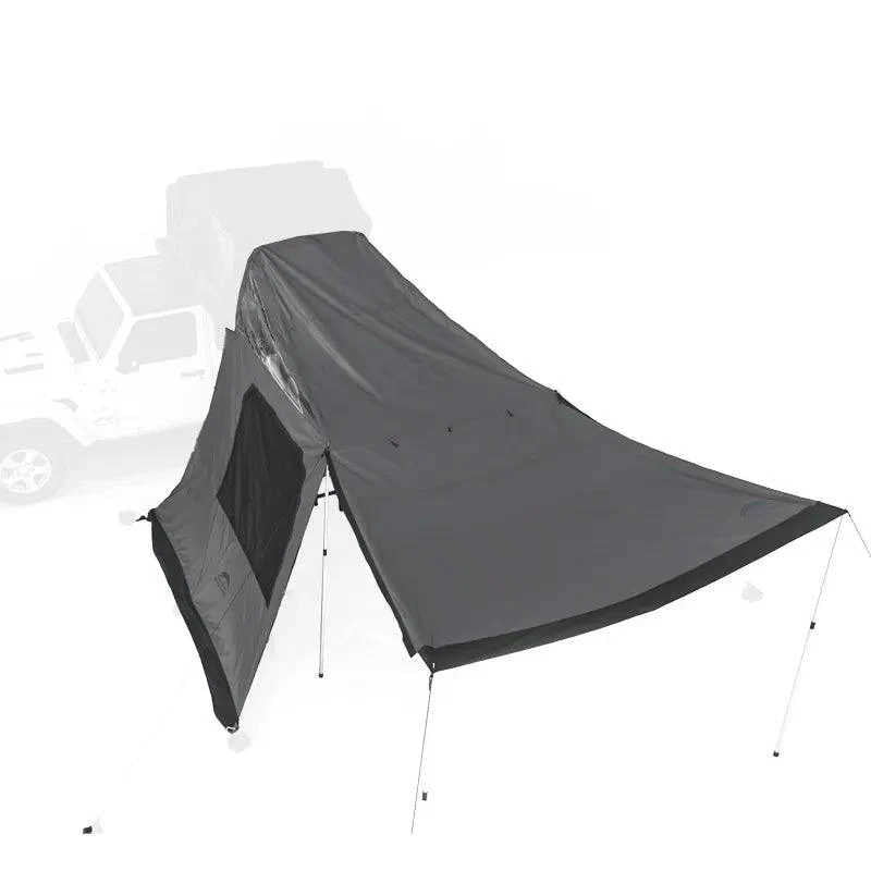 Black camping tent with car in the background