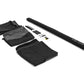 Black tent parts including fabric and poles on a white background