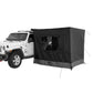 Black tent attached to a white Jeep on a white background