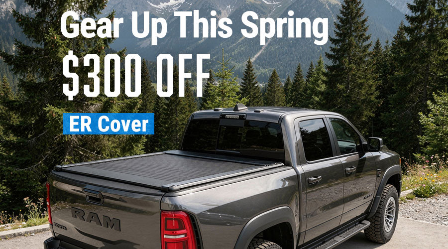 Gray RAM truck with a tonneau cover in a forest setting, promotional text overlay for $300 off an ER cover.
