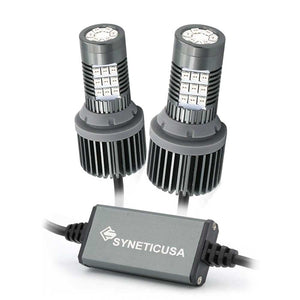 Two red LED brake light bulbs with heat sinks and an electronic control unit, branded Syneticusa.