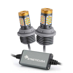 Two LED bulb replacements for front turn signal lights with a controller box, featuring Syneticusa branding, against a white background.