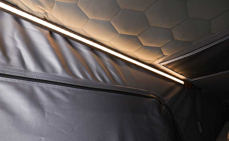 Foam mattress and storage bag with text labels on a gray background