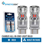 Two silver SyneticUSA canbus all-in-one 3157 light bulbs with built-in fans and red LED accents, shown alongside their blue retail blister packaging on a white background with product text overlays.