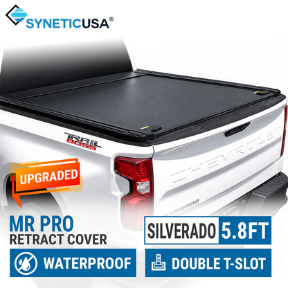 A black Synetic USA MR Pro retractable truck bed cover installed on the bed of a white Chevrolet Silverado 5.8 ft, shown from the rear three-quarter angle with promotional text overlays.