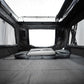 Interior of a Sky Rover camping tent with a mattress on a gray floor.