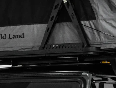 Roof rack system on a vehicle with 'Wild Land' branding.