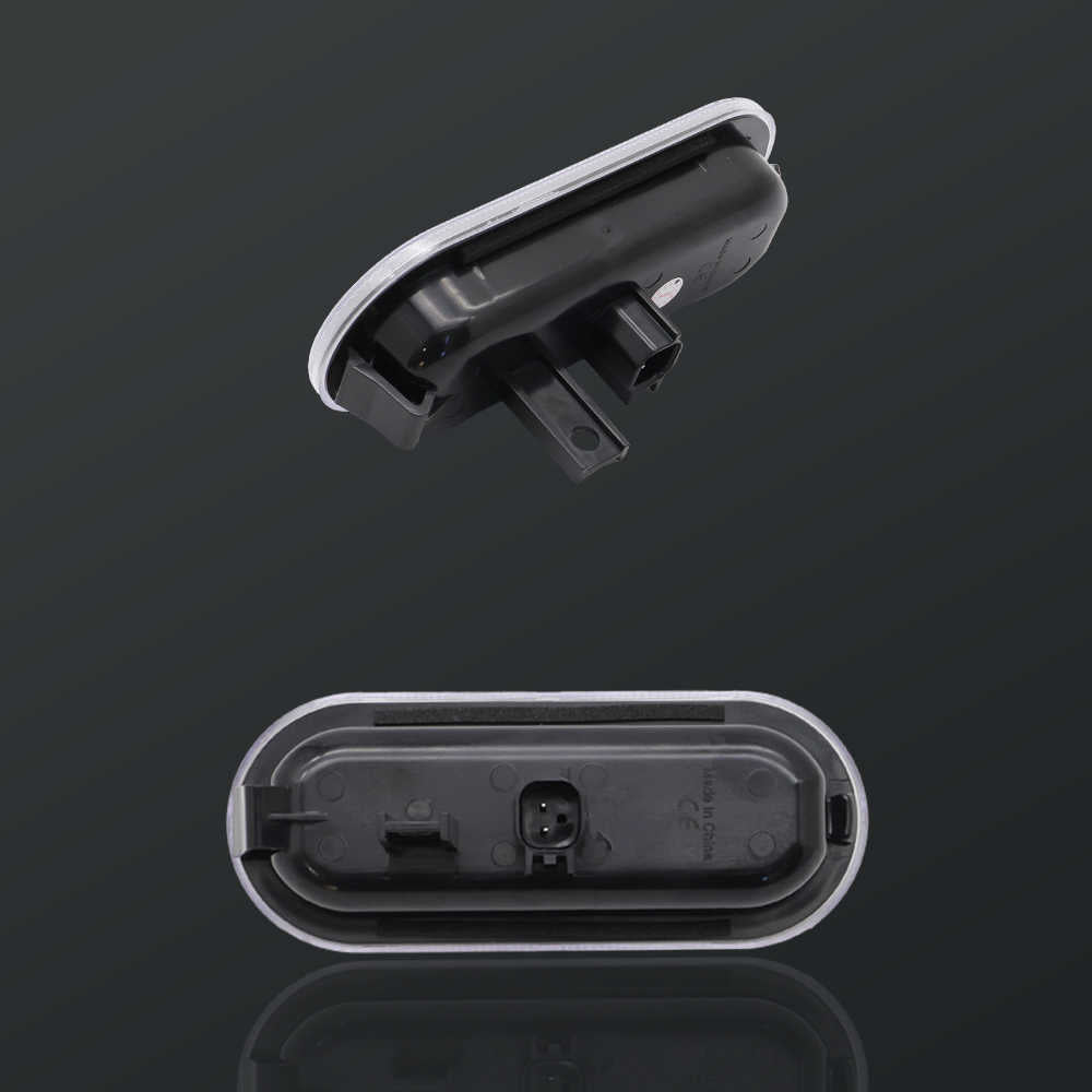 Two black plastic components on a dark background