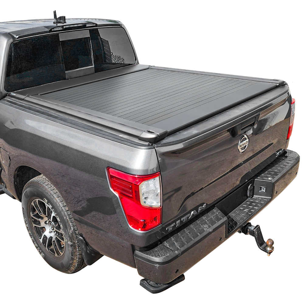 Gray pickup truck with a SYNETICUSA AR retractable PRO tonneau cover on a white background