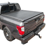 Gray pickup truck with a SYNETICUSA AR retractable PRO tonneau cover on a white background