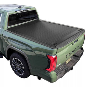 Green Toyota Tundra truck with a black enhanced mb tonneau cover on a white background