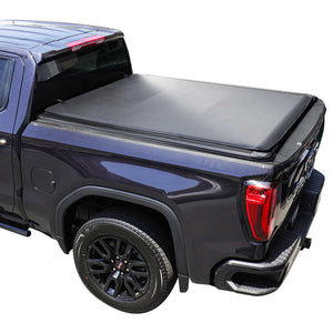 metallic blue Sierra truck with a syneticusa soft roll-up tonneau cover on a white background