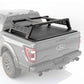Gray Ford truck with a black tonneau cover and roof rack on a white background