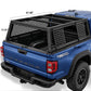 Black metal truck bed canopy cage installed on the bed of a blue Tacoma truck, shown from the rear three-quarter angle with dimension callouts overlaid on the image.