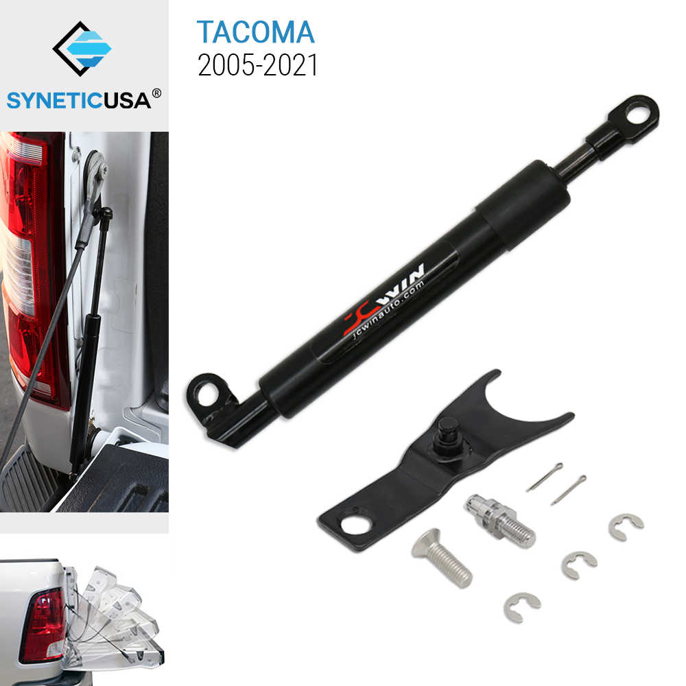 Car tailgate support with installation hardware and SYNETICUSA branding on a white background.