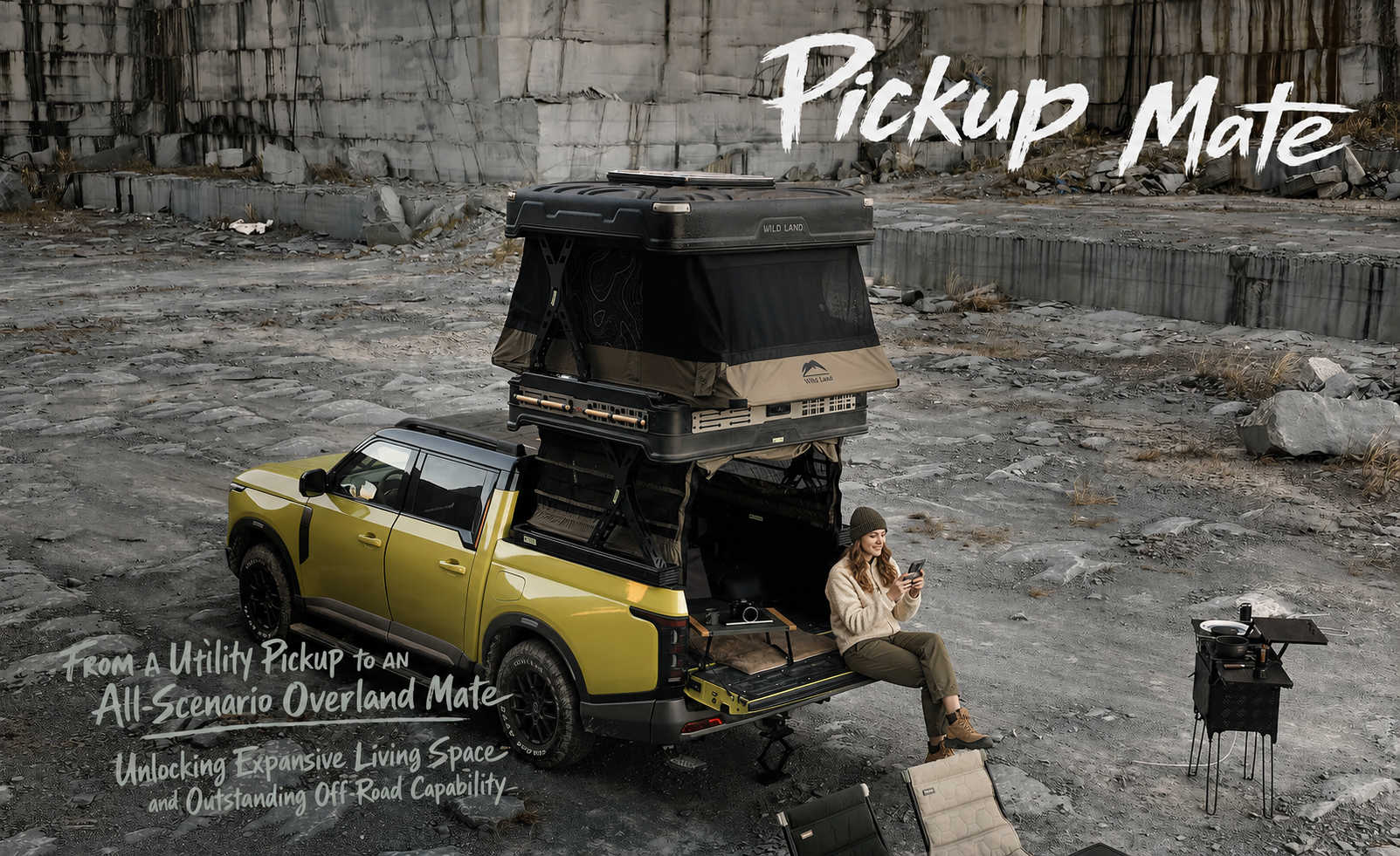 Yellow pickup truck with a rooftop tent in an industrial setting, featuring 'Pickup Mate' from Wild land.