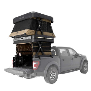 Gray truck with a WingmanX rooftop tent extended on a white background