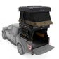 Roof top tent attached to a truck bed with 'Wild Land' branding.