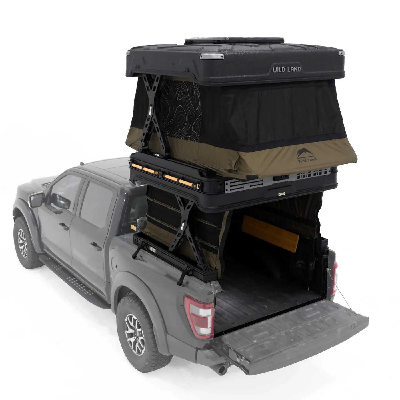 Roof top tent attached to a truck bed with 'Wild Land' branding.