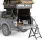 Truck bed with a rooftop tent and attached ladder on a white background