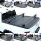 Collage of a Nissan truck bed with various accessories including a tonneau cover, side panels, and overland racks.