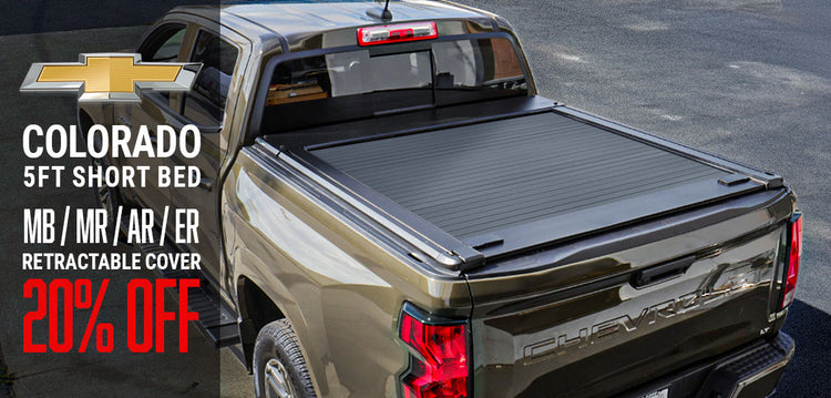 Chevrolet Colorado truck with a retractable cover on a road background, featuring promotional text.