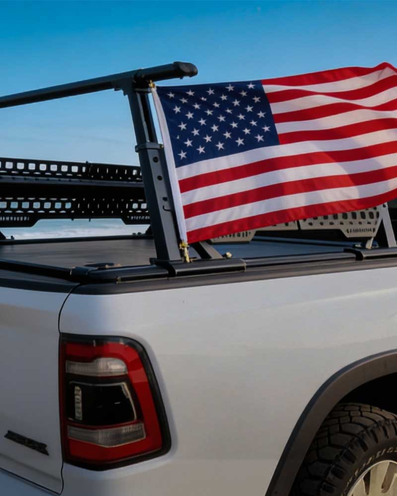 American flag on a truck bed with a clear blue sky