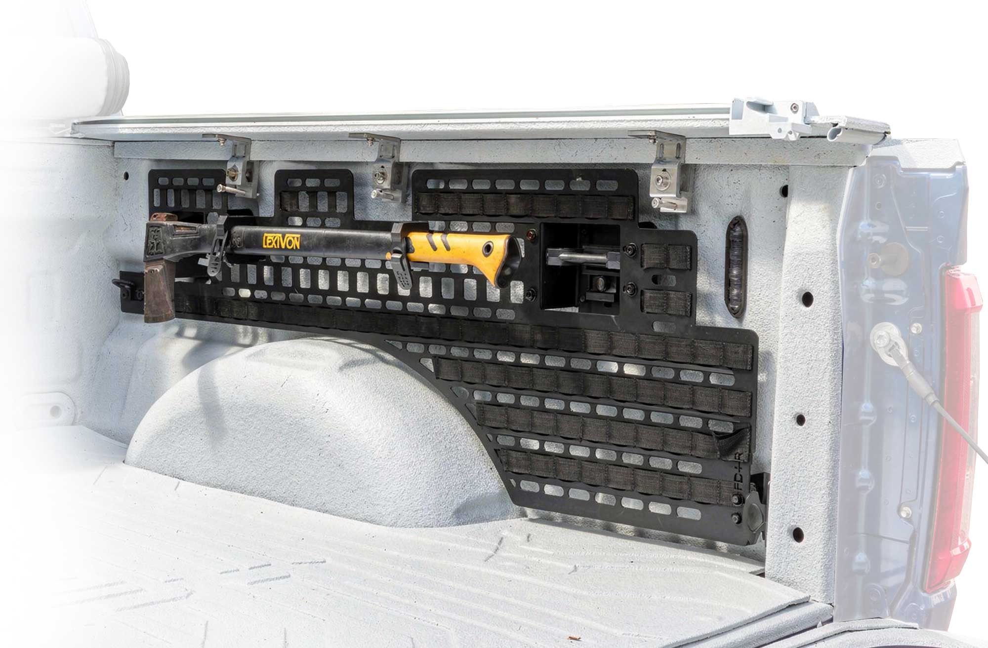 Trunk organizer bed side molle panel with compartments in a vehicle's cargo area