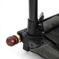 Close-up of a black metal stand with a wooden ball on a white background