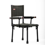Black and green hunting chair with adjustable armrests on a white background