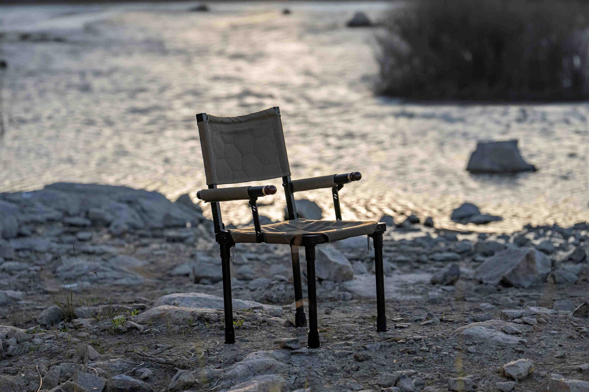 mts-c Chair on a rocky beach with water in the background
