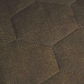 Close-up of green textured fabric with a subtle geometric hexagonal pattern.