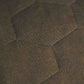 Close-up of a textured green fabric with geometric pattern