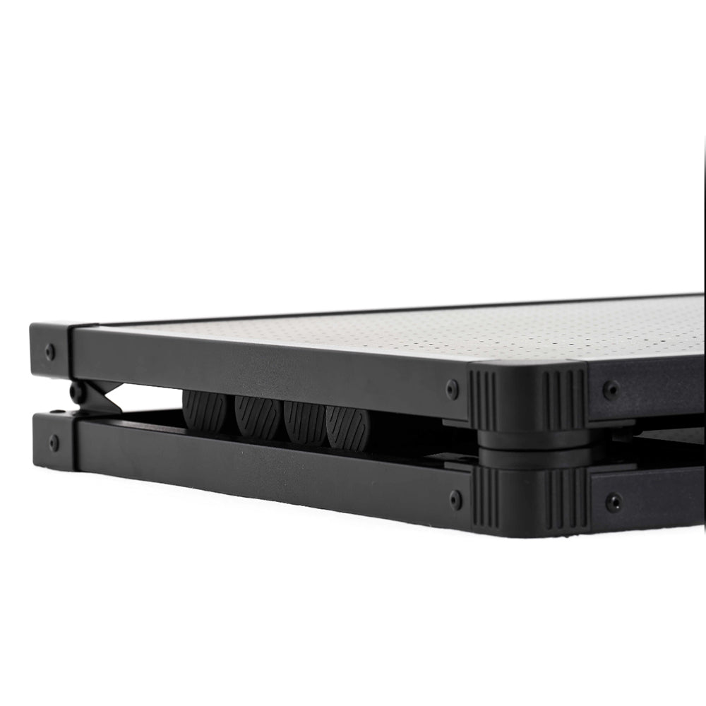 Folded metal table with perforated tabletop and black frame.