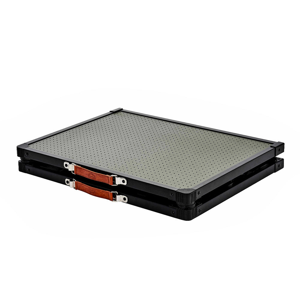 Folded Wild Land MTS-C aluminum camping table with carrying straps, shown in a compact storage position.