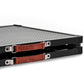 Close-up of  a foldable metal platform with perforated panels, black frame, and brown leather carrying handles.