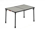 Portable folding table with mesh top on a white background