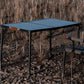 Camping table and chair set in a natural outdoor setting