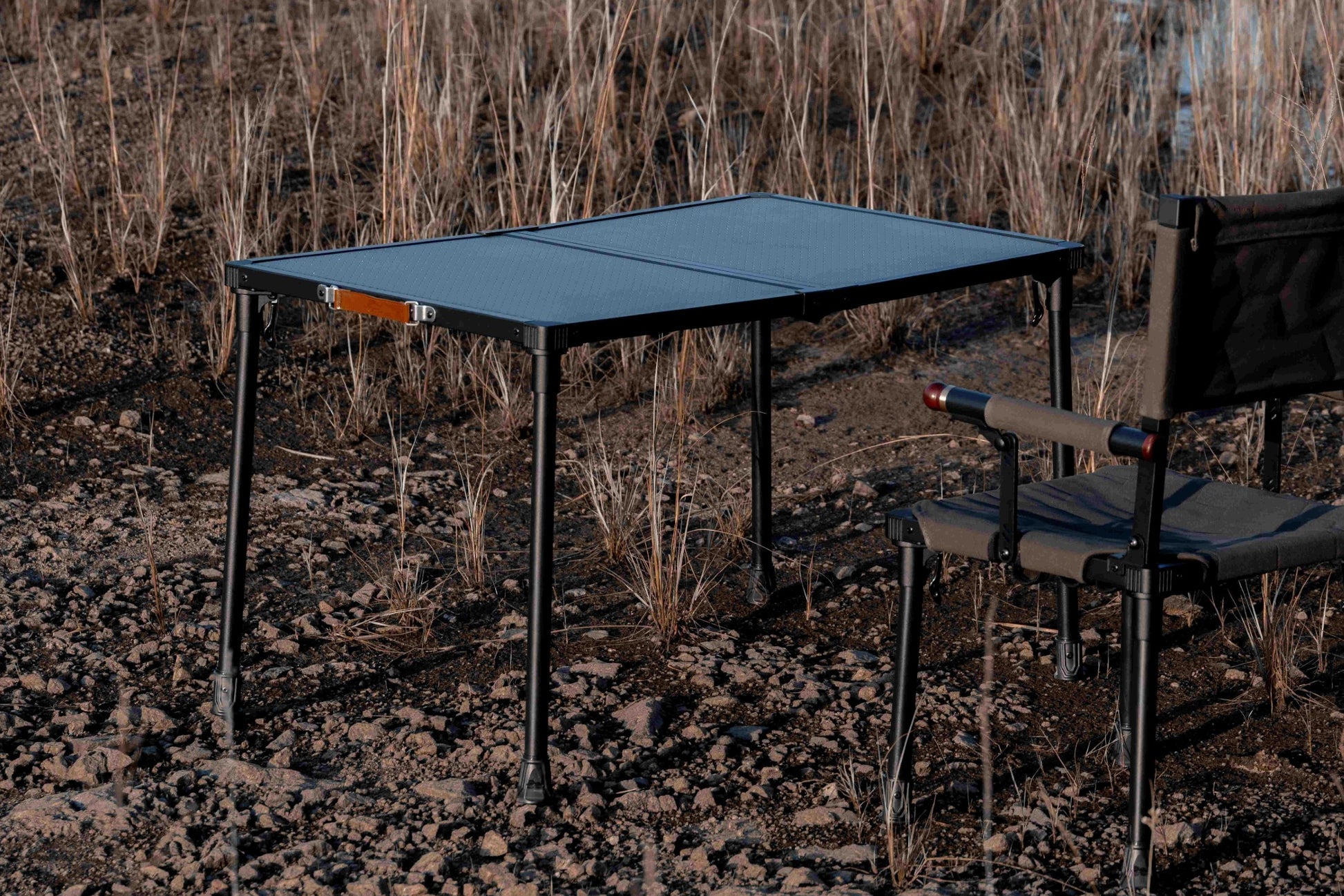 Camping table and chair set in a natural outdoor setting