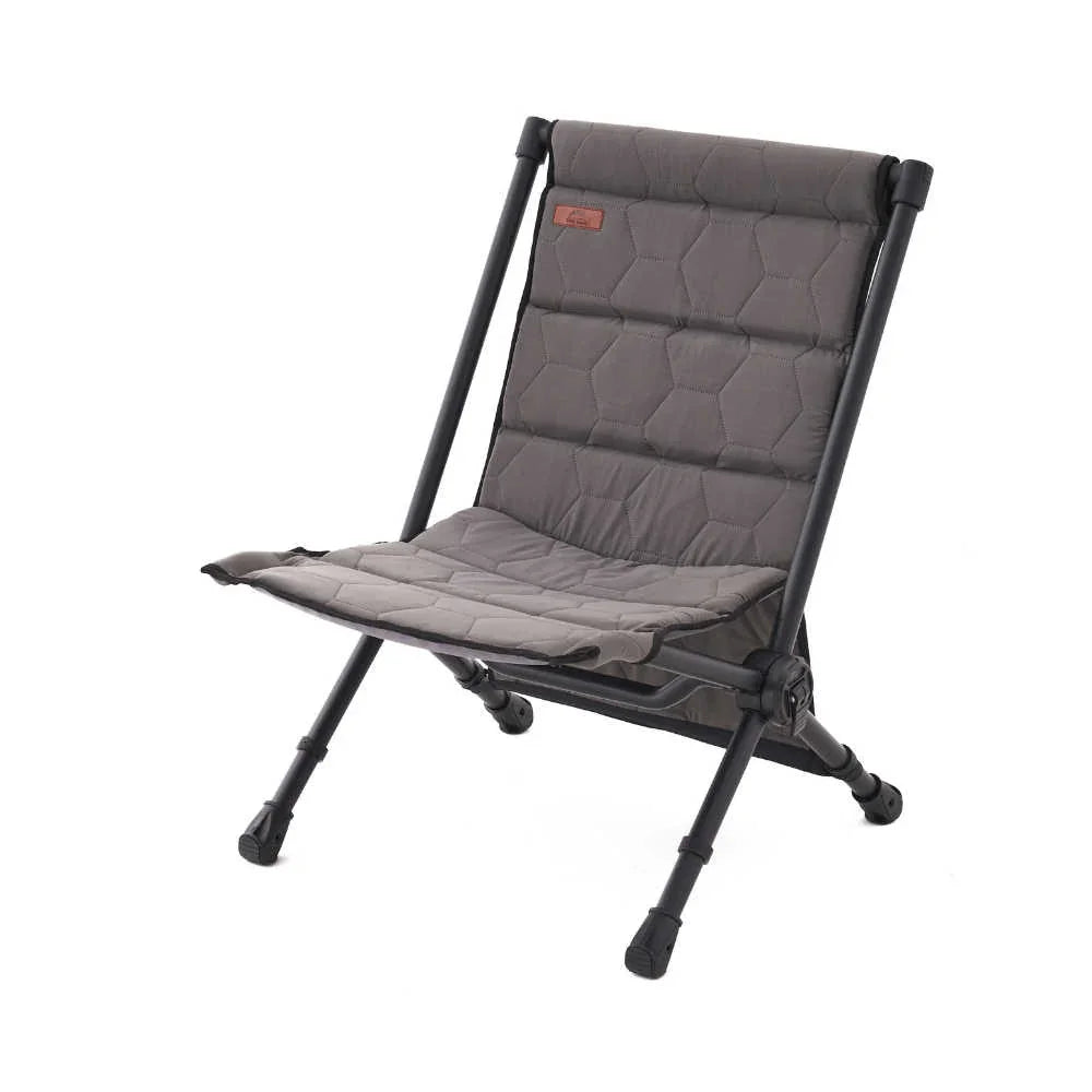 Gray camping chair with quilted seat on a white background