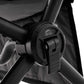 Close-up of a black stroller handle with a visible brand logo on a white background