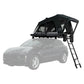 Roof top tent orthframe attached to a car on a white background