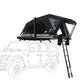 Roof top tent attached to a vehicle with a ladder on a white background