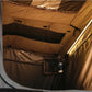 Close-up of a brown tent interior with a light source.